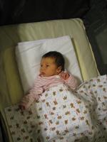 Sleeping in her travel crib in Fresno