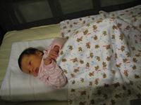 Sleeping in her travel crib in Fresno