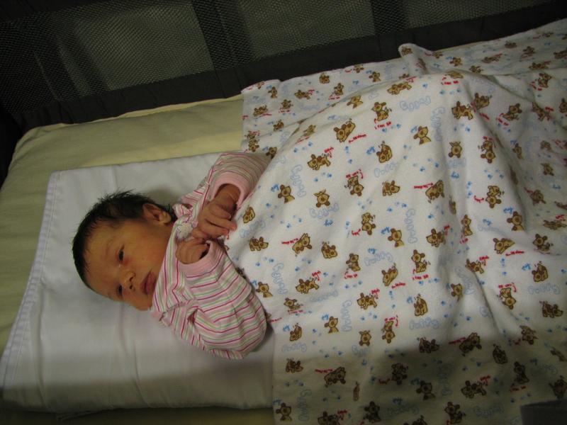 Sleeping in her travel crib in Fresno