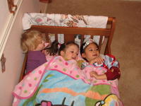 Misha, Katya and Kayley playing in Katya's room