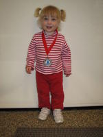 Misha posing with Katya's medal