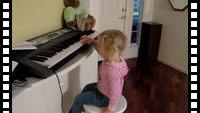 Misha playing on a piano