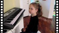Katya playing on a piano