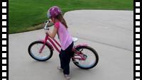 Katya learning to get on the bike
