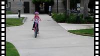 Katya riding a bicycle