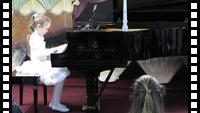 Katya playing "The Holly and the Ivy" in music recital